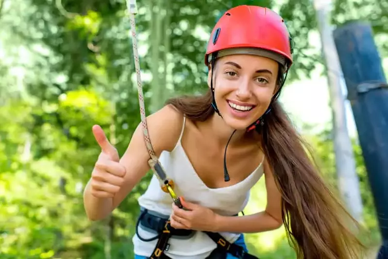 Young woman at a zipline course