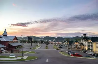 View facing the Parkway in Sevierville with the Lodge at Five Oaks on the right, Five Oaks Farm Kitchen on the left, and Tanger Outlets across the Parkway